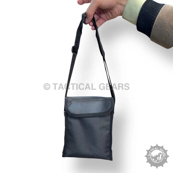 Black tactical shoulder bag with flap closure, perfect for portable binocular storage