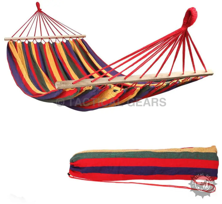 Colorful striped hammock with wooden spread bars and matching travel bag