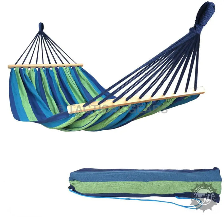 Blue and green striped hammock with wooden spread bars and matching travel bag