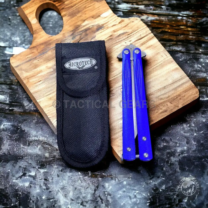 Blue butterfly knife with black nylon sheath, approx 8 inches, ideal for collectors