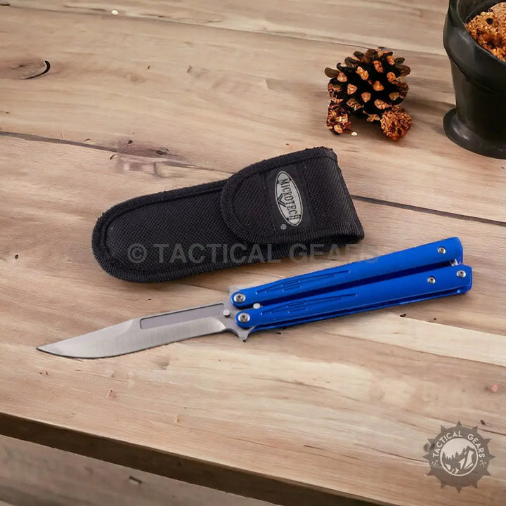 Blue butterfly knife with silver blade and black sheath, approximately 8 inches long