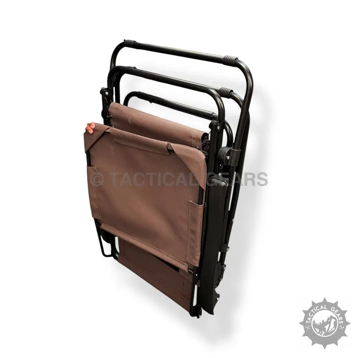 Foldable brown camping cot with black metal frame, ideal as a zero gravity folding beach chair