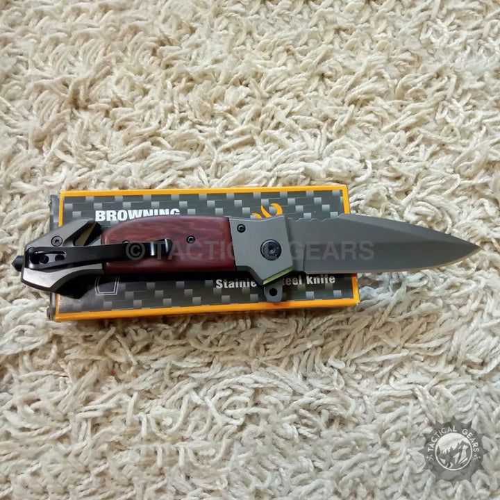 Browning DA167 folding knife with black blade and wooden handle