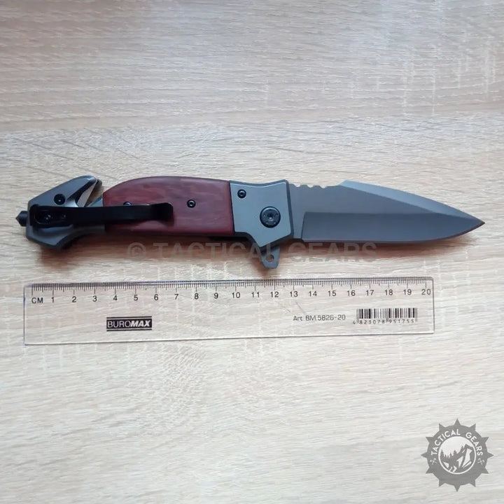 Browning DA167 wooden handle folding knife with serrated dark gray blade