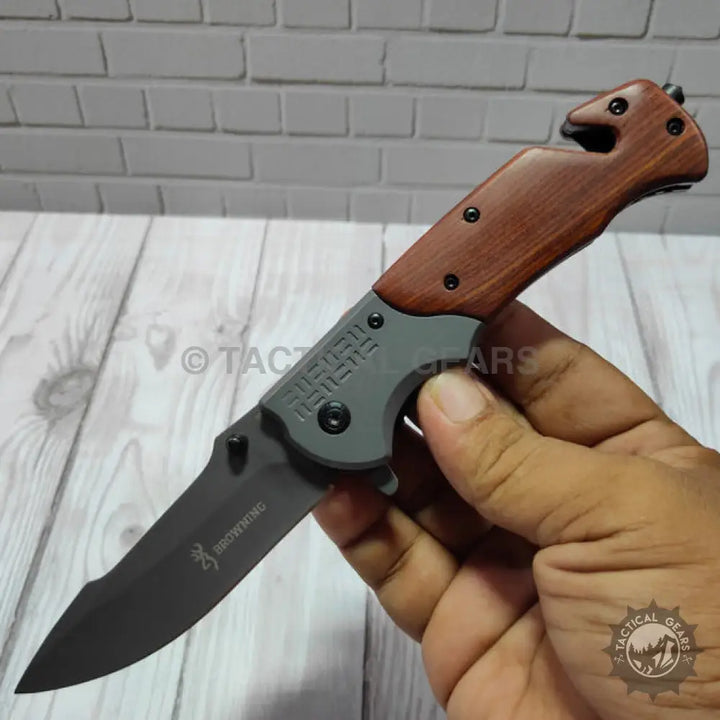 Browning DA308 tactical knife with black blade and wooden handle
