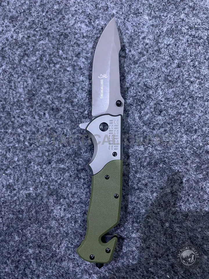 Browning DA308 tactical knife with green folding handle and silver blade