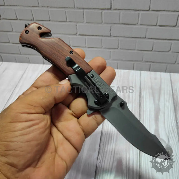 Browning DA308 tactical knife with wooden handle and black blade