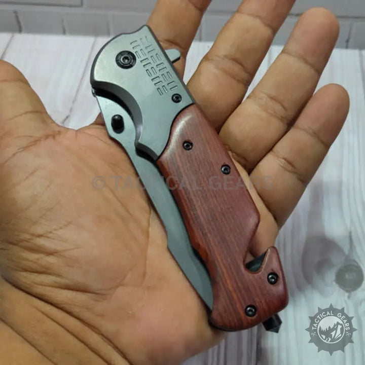 Browning DA308 tactical knife with wooden handle and silver blade