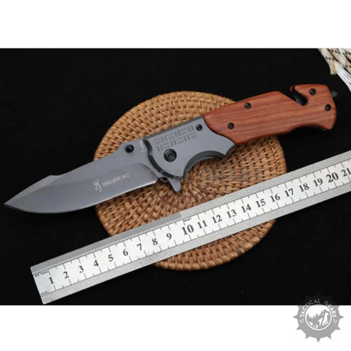 Browning DA308 tactical knife with wooden handle and silver blade, 21 cm