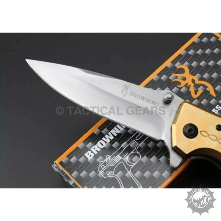 Browning DA77 titanium folding knife with gold silver blade and logo
