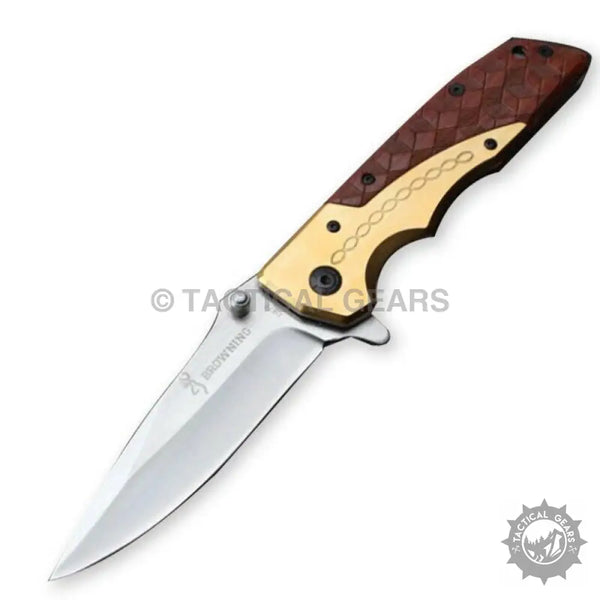 Browning DA77 titanium folding knife with gold handle and silver blade