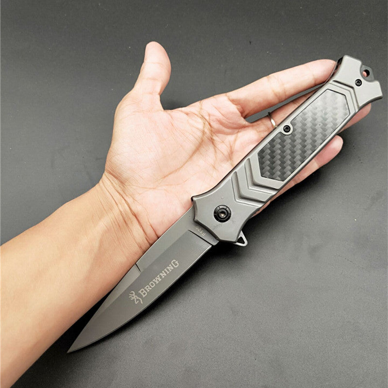 Browning F129 folding knife with black carbon fiber handle and 3cm silver blade