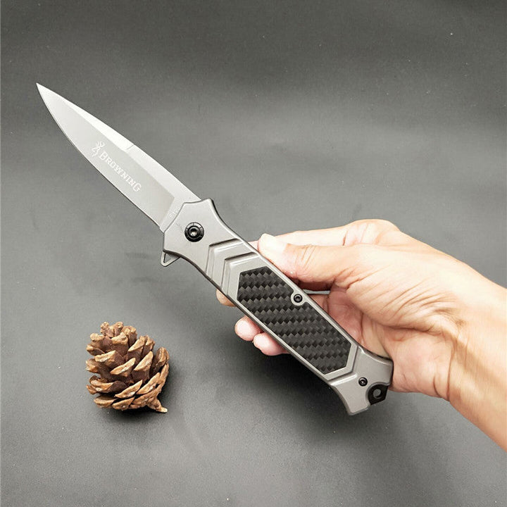 Silver folding knife with 3cm blade, black textured handle, carbon fiber inlay, Browning-F129