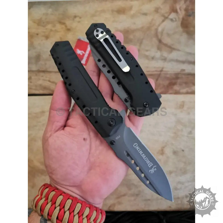 Browning F66 folding knife with black handle, grey blade, and pocket clip