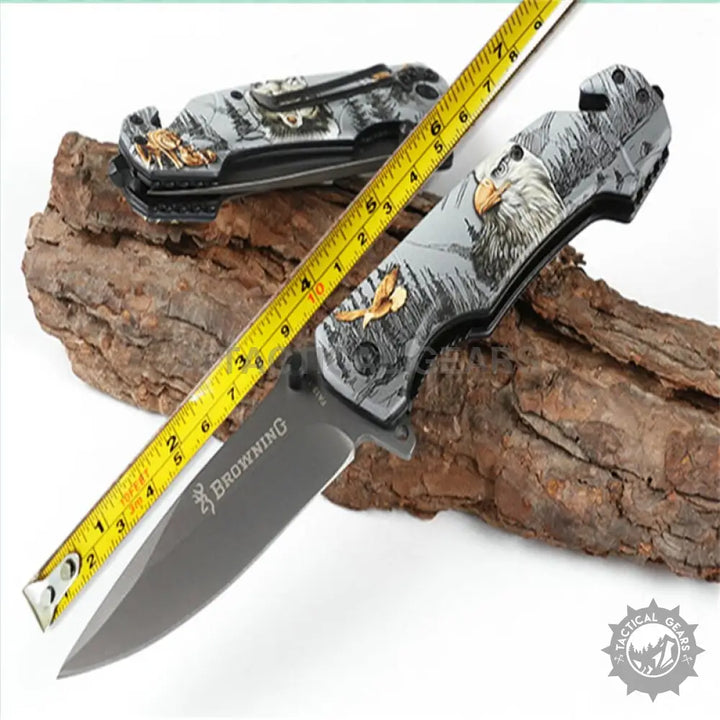 Browning FA18-1 folding knife with wolf design, black handle, silver blade