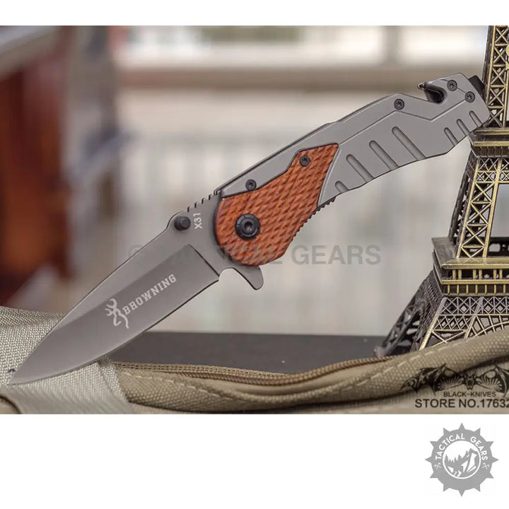 Gray folding knife with textured brown handle and sharp blade for optimal length performance