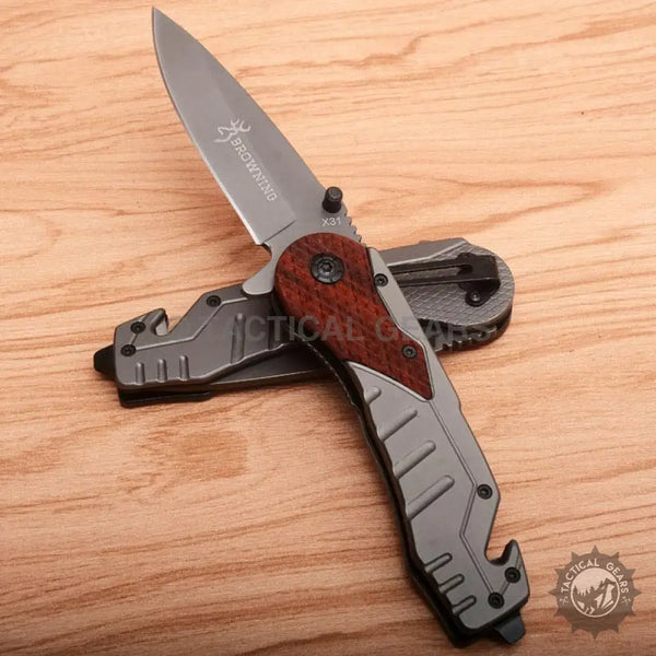 Browning X31 Knife with gray blade and handle featuring red wood inlay and gray metal accents