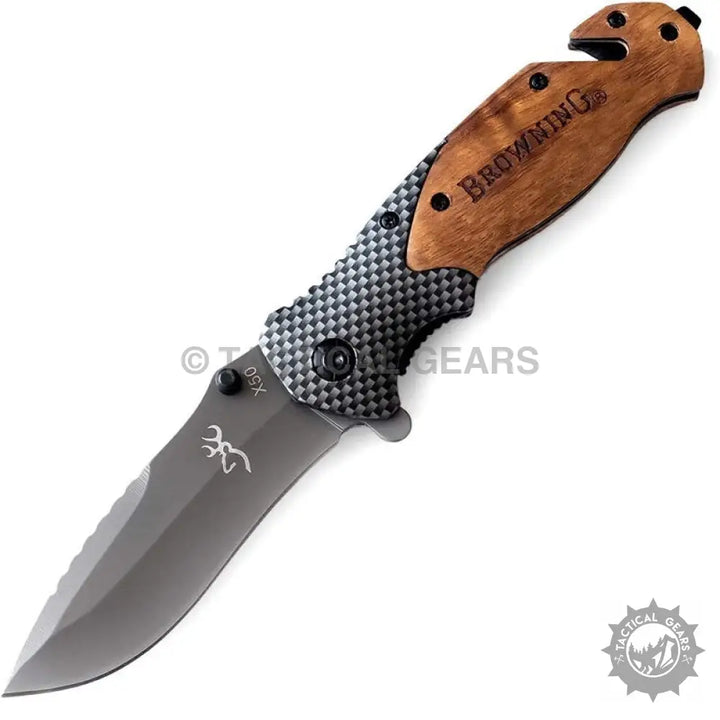 Browning X50 folding knife with wood and carbon fiber handle and built-in seatbelt cutter