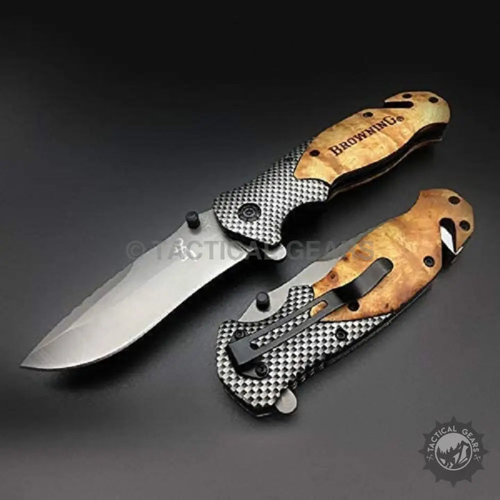 Browning X50 folding knife with patterned metal and wood-grain handles, open and closed