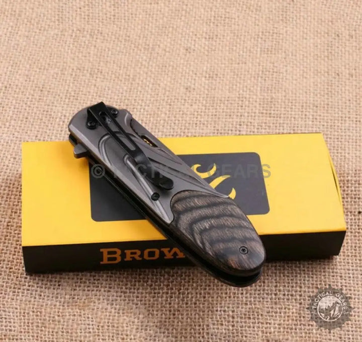 Browning X56 folding pocket knife with wood handle and 8cm blade on yellow box