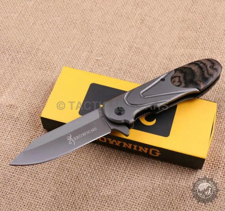 Browning X56 folding pocket knife with black wood handle and 8cm silver blade