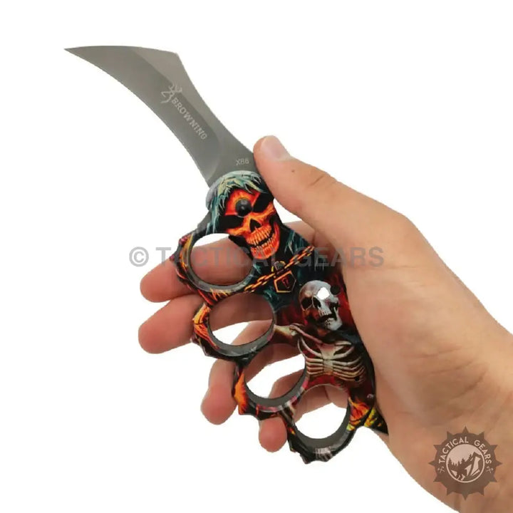 Black skull knuckle duster with silver accents on Browning x86 travel knife
