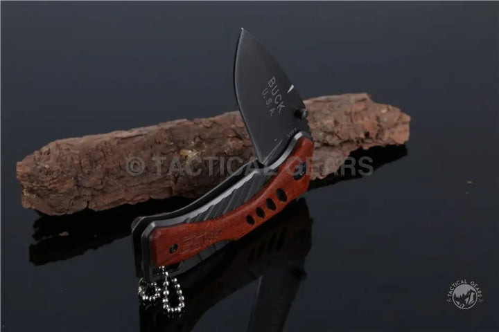 Black folding knife with curved blade and reddish-brown handle for Buck USA X61 tactical survival