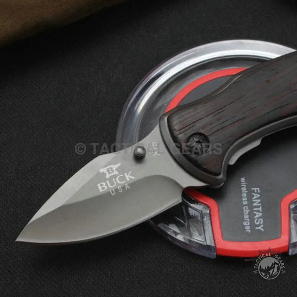 Dark wood-handled Buck USA X75 Classic Mini Knife with grey blade for outdoor use