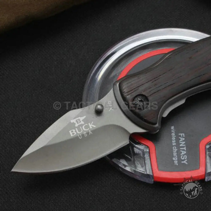 Dark wood-handled Buck USA X75 Classic Mini Knife with grey blade for outdoor use