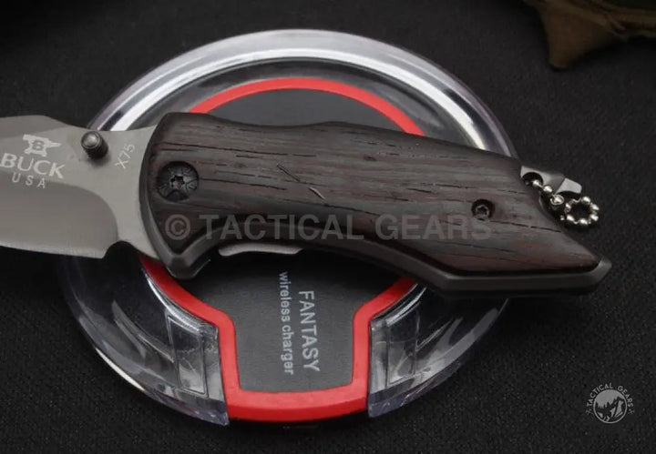 Buck USA X75 Classic Mini Knife with a dark wooden handle for collectors