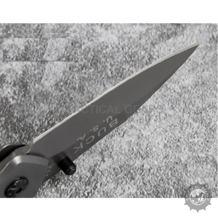 Gray Buck USA Buck X11 Folding Knife with pointed blade that measures durable and sharp