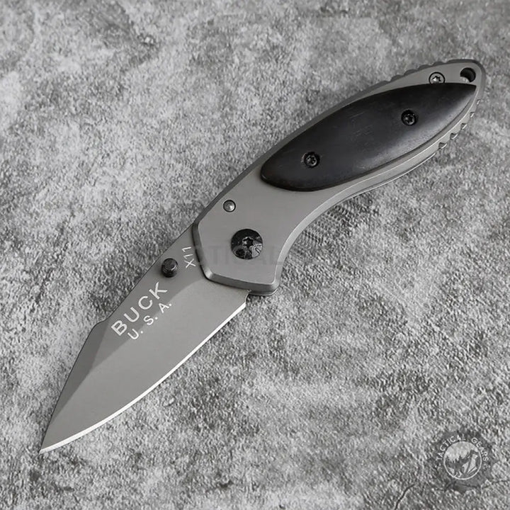 Gray folding knife with black handle and sharp blade measuring compact for everyday carry