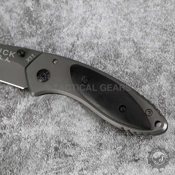 Buck X11 Folding Knife with dark gray blade and black handle measures for versatile use