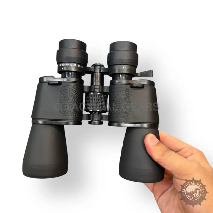 Black Bushnell 70x70 zooming binoculars with adjustable eyepieces and textured grip