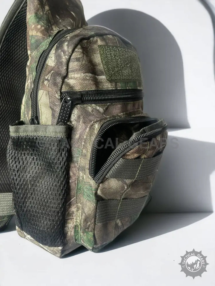 Camo Hunting Sling Bag with multiple zippered compartments and mesh side pocket