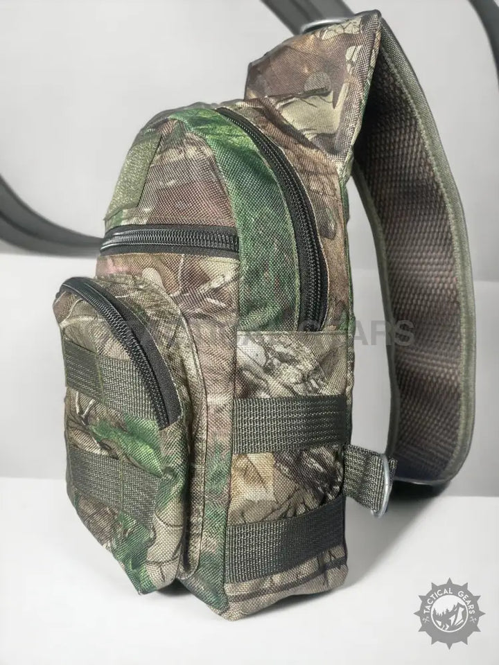 Camouflage single-strap sling bag with multiple zippered compartments for hunting or outdoor use