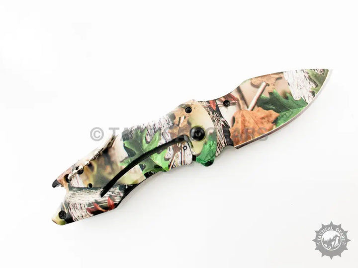 Buck X75 Camo Hunting Knife with 00cm blade and camouflage-patterned folding design