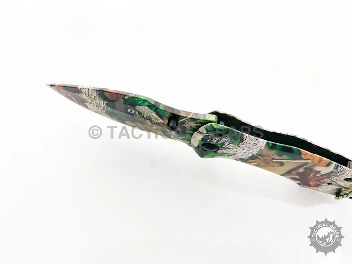 Buck X75 Camo Hunting Knife with 00cm blade and folding pocket design