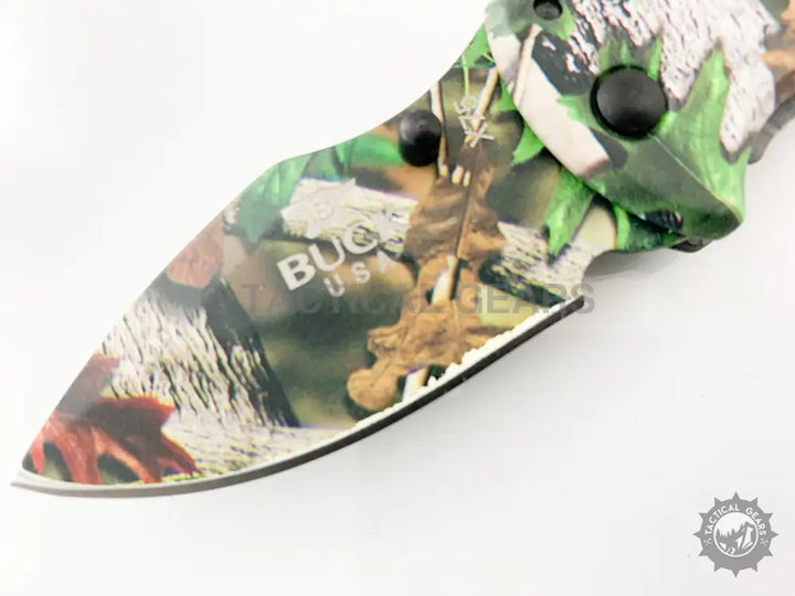 Camouflage-patterned Buck X75 Camo Hunting Knife with 00cm partially serrated blade