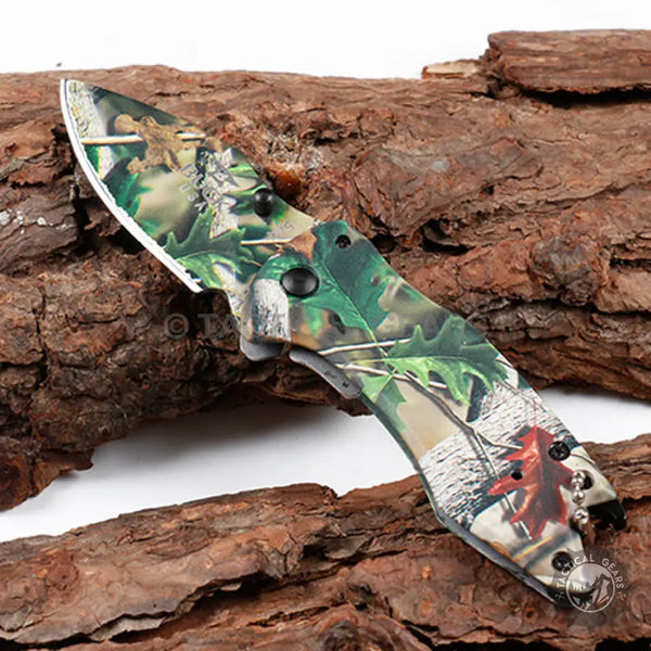 Camo-patterned folding Buck X75 Hunting Knife with 00cm blade and clip for outdoor use