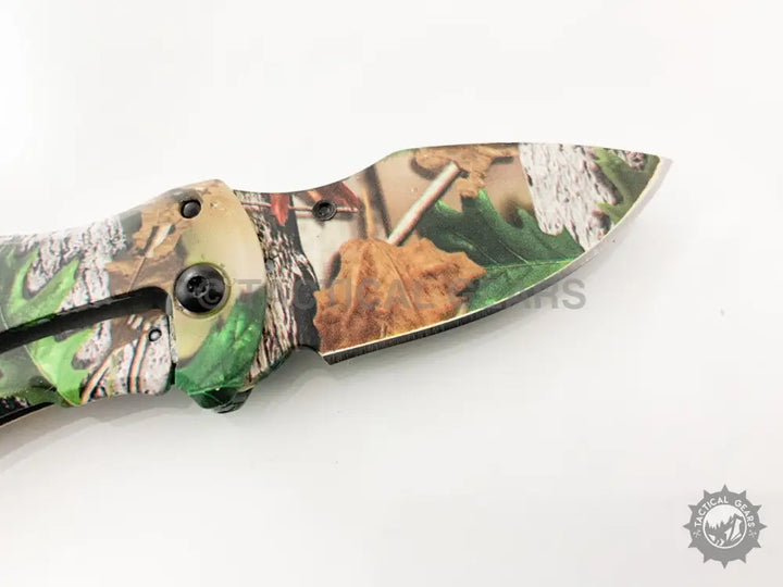 Camo-patterned Buck X75 Hunting Knife with 00cm blade and folding pocket design