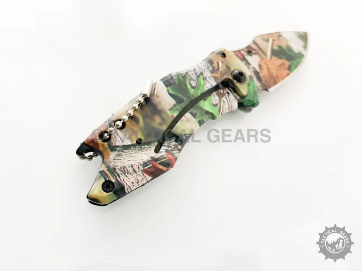 Camo-patterned Buck X75 Hunting Knife with 00cm blade, folding pocket design, black belt clip