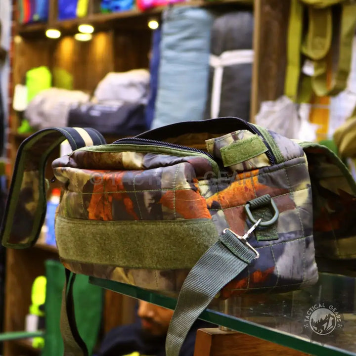 Camouflage tactical shoulder bag with padded main compartment and adjustable strap in 12 inch size