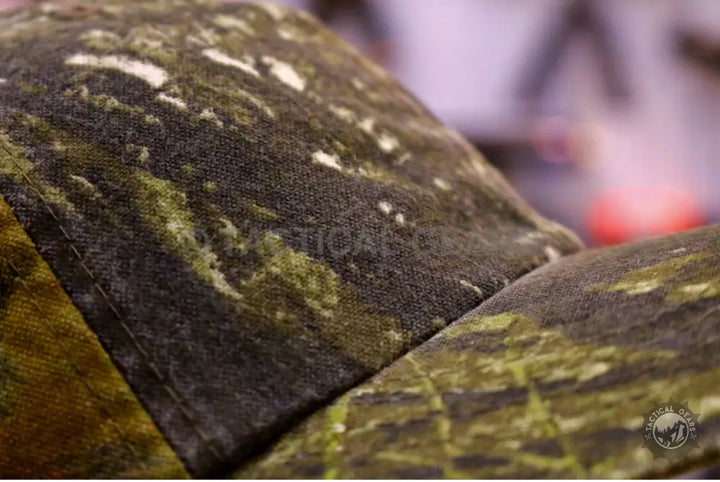 Close-up of camouflage fabric on Tactical Camo Cap highlighting textured surface and customer support