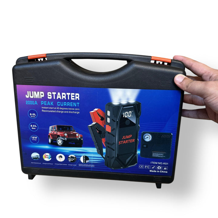 Black car jump starter kit with tire inflator in carrying case for emergency car use