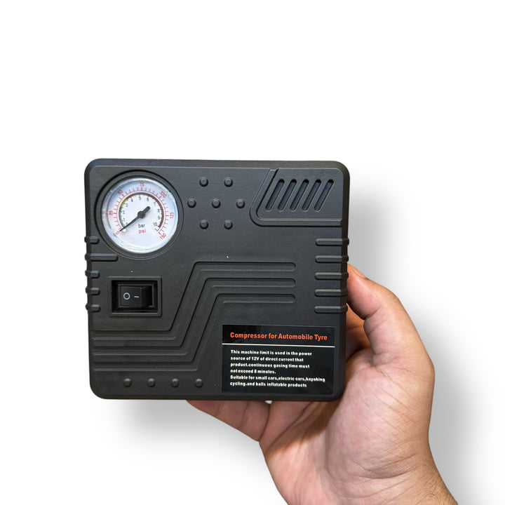 Black portable air compressor with pressure gauge and on/off switch for car jump and tire inflator