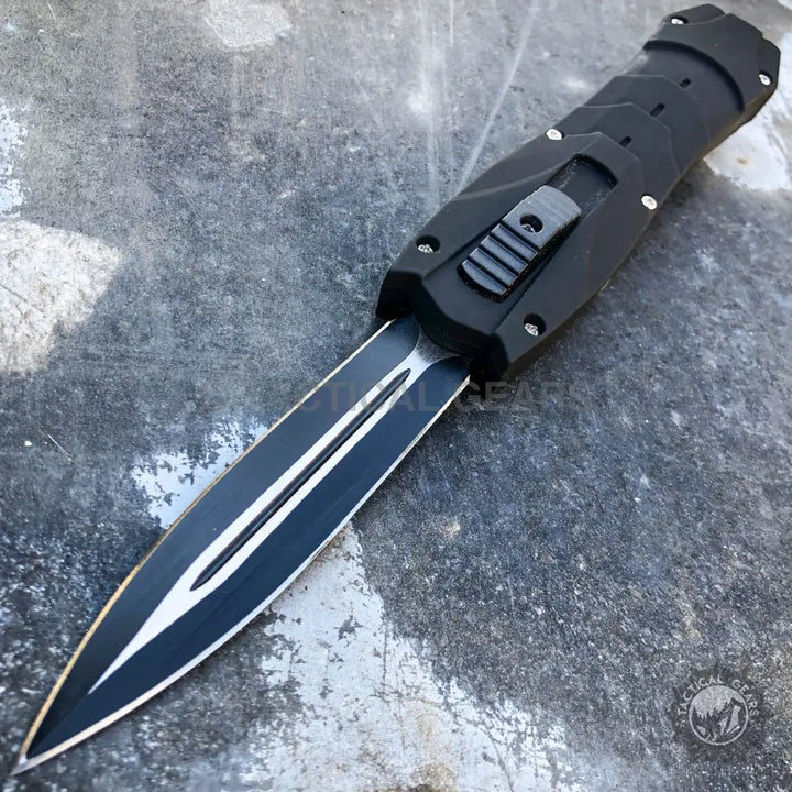 Black double-edged out-the-front automatic knife from Combat OTF Knives with carbon fiber handle