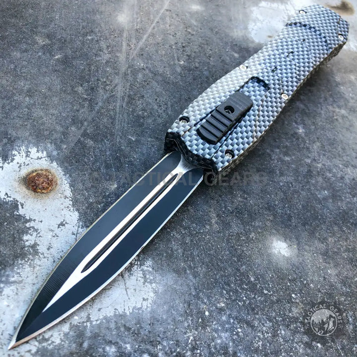 Black and silver Combat OTF Knives with carbon fiber handle and dagger blade