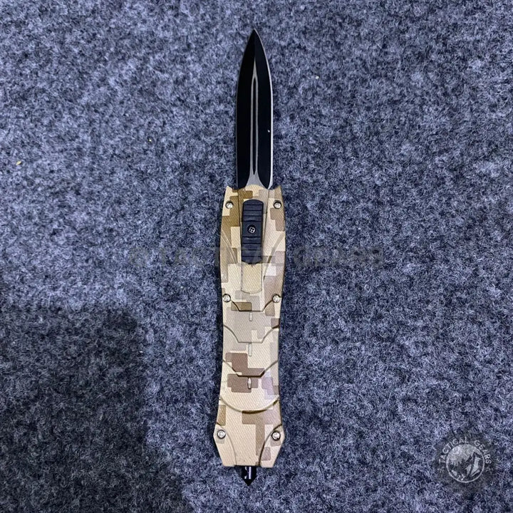 Tan and brown camouflage combat OTF knives with black dagger-style blade and carbon fiber handle