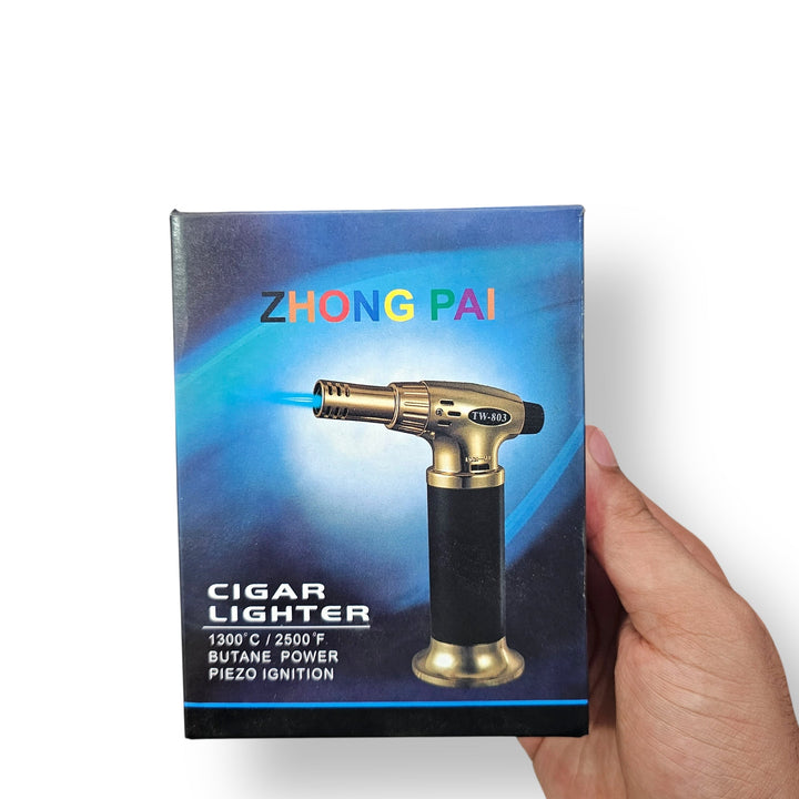 Imported cigar lighter with gold and black finish and blue flame for premium cigars